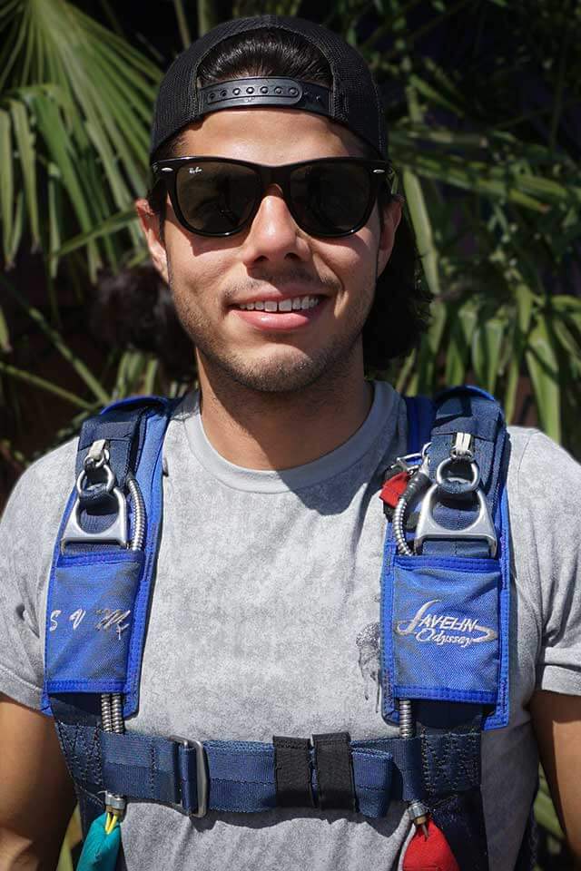 A smiling image of Skydive The Volcano's packer Vicente Mendoza.